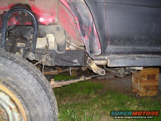 Rear leaf spring suspension part on a vehicle