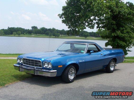 Blue 1973 Ford Ranchero parked by a lake, 3q-front view