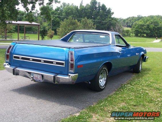 Blue 1973 Ford Ranchero rear view with black tonneau cover