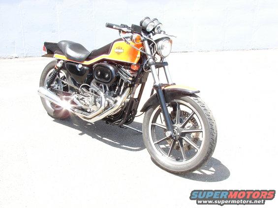 Orange and black Harley-Davidson motorcycle, 3q-front view
