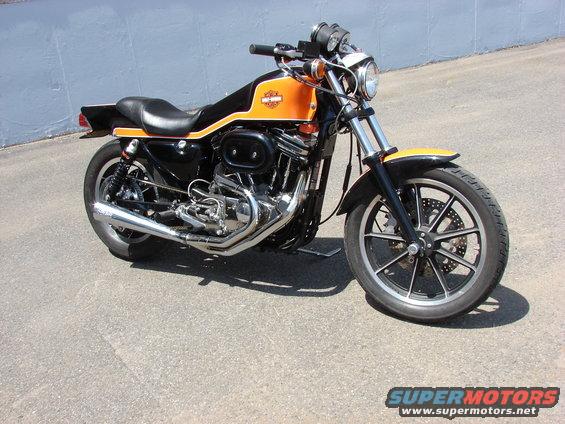 Orange and black Harley-Davidson Sportster motorcycle, 3q-front view