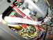 2002 Yamaha R1 - A complex arrangement of electronic parts and wires is visible in this close-up view.