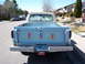 1963 Ford F-100 - This 1963 Ford F-100 pickup truck is seen from the rear, with the tailgate displaying the brand name and several awareness ribbons.