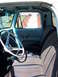1963 Ford F-100 - Interior view of a light blue truck, showing the seats, steering wheel, and door panel.