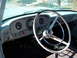 1963 Ford F-100 - The dashboard and steering wheel of a 1963 Ford F-100, showing its classic interior design.