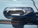 1963 Ford F-100 - Close-up of the "Custom Cab" emblem on a vintage truck door handle.