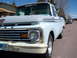 1963 Ford F-100 - Front view of a 1963 Ford F-100 pickup truck, showing its distinctive grille and bumper design.