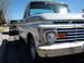1963 Ford F-100 - Two Ford F-Series trucks parked on a sunny day, one in front of the other.
