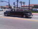 1986 Ford Bronco - This vintage pickup truck, likely from the 1940s, is seen driving on a sunny day.