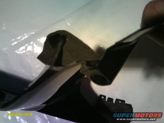 Black and white vehicle part with foam padding