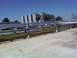 1989 Ford Bronco - A view of industrial cooling towers and a network of pipes on a clear day.