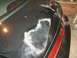 1998 Lincoln Mark VIII - The paint on this car's trunk is severely damaged, with white residue visible.