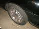1998 Lincoln Mark VIII - Close-up of the rear wheel and fender of a 1998 Lincoln Mark VIII.