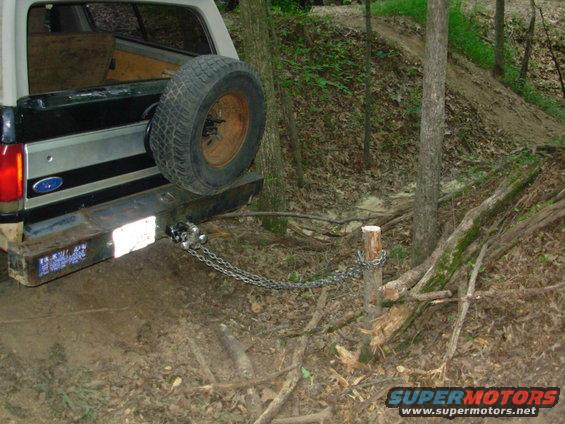 100703astump.jpg Yesterday, Greg & I decided that this tree was in the way, so after chain-sawing it down to ~2 feet, I chained onto it.  Greg's Disco is currently down waiting for a replacement shock.