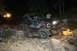 1984 Ford Bronco II - A modified off-road vehicle is shown traversing a challenging rocky path in the dark.