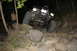 1984 Ford Bronco II - An SUV is parked outdoors at night, with its headlights illuminating the surrounding area.