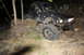 1984 Ford Bronco II - Off-road vehicle navigating a dirt path in a wooded area at night.