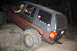 1984 Ford Bronco II - This Jeep Grand Cherokee navigates a challenging rocky terrain during an off-road excursion.