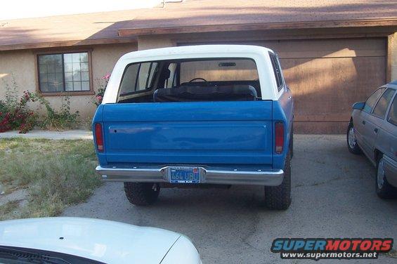 1978 Ford Bronco rear view, blue body with white top, parked in driveway
