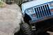 1984 Ford Bronco II - Jeep Wrangler's vertical grille and square headlights suggest a 1990s model, not a 1984 Ford Bronco II.