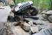 1984 Ford Bronco II - Modified Jeep Cherokee XJ navigates a challenging rocky terrain on an off-road trail.