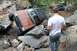 1984 Ford Bronco II - An off-road vehicle is stuck on a rocky trail, with onlookers observing the situation.