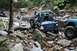 1984 Ford Bronco II - Off-road vehicles navigate a challenging rocky terrain, their off-road capabilities.