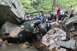 1984 Ford Bronco II - Several off-road vehicles tackle a challenging rocky stream, demonstrating their capabilities in terrain.