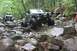 1984 Ford Bronco II - Off-road vehicles tackle a challenging rocky trail, their capabilities on difficult terrain.