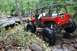 1984 Ford Bronco II - This heavily modified off-road vehicle tackles a challenging rocky trail, its capabilities.