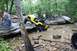 1984 Ford Bronco II - Off-road enthusiasts watch as a yellow vehicle tackles a challenging water obstacle.