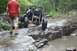1984 Ford Bronco II - A custom off-road buggy navigates a challenging rocky terrain with water obstacles.