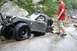 1984 Ford Bronco II - Off-roading Bronco II gets a flat tire while navigating rocky terrain.