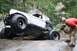 1984 Ford Bronco II - A modified off-road vehicle attempts to traverse a challenging rocky stream bed.