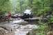 1984 Ford Bronco II - Off-road adventure in a 1984 Ford Bronco II navigating a challenging rocky path.