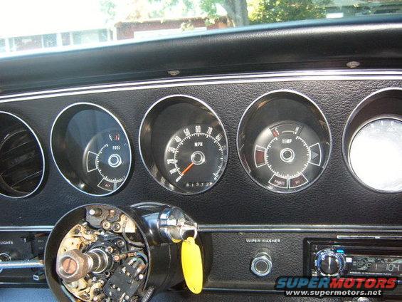 Dashboard gauges with fuel, speedometer, and temperature readings. 1973 Ford Ranchero