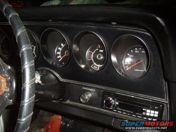 1973 Ford Ranchero interior dashboard with tachometer, temperature gauge, and fuel gauge