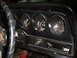 1973 Ford Ranchero - The interior dashboard of a 1973 Ford Ranchero features a tachometer, temperature gauge, and fuel gauge, along with a wiper washer switch a…