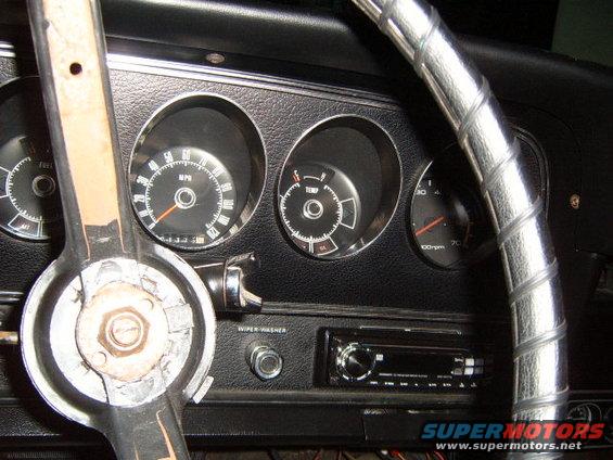 1973 Ford Ranchero interior dashboard with speedometer, temperature gauge, and radio