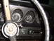 1973 Ford Ranchero - The interior of a 1973 Ford Ranchero shows a dashboard with gauges, a steering wheel, and an aftermarket radio.