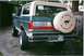1990 Ford Bronco - The rear view of a 1990 Ford Bronco shows its distinctive body style and spare tire.