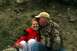 1990 Chevrolet Suburban - A father shares a tender moment with his daughter outdoors.