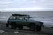 1990 Chevrolet Suburban - Chevrolet K5 Blazer on a beach, likely modified for off-roading.