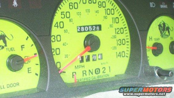 Dashboard gauges with yellow face, showing odometer reading 280526, fuel, and temperature