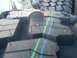 1989 Ford Bronco - A tire tread is shown up close, with a coin placed on it to indicate its size.