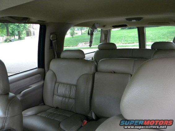 1999 Chevrolet Suburban interior showing tan leather seats and windows