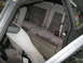 1985 Ford Mustang - The interior of a 1985 Ford Mustang shows gray velour rear seats with red piping and a Holley sticker on the window.
