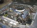 1985 Ford Mustang - Engine bay of a Ford vehicle, likely a Mustang, with V8 engine components visible.