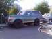 1986 Ford Bronco - This 1986 Ford Bronco is seen parked on a street next to another vehicle.