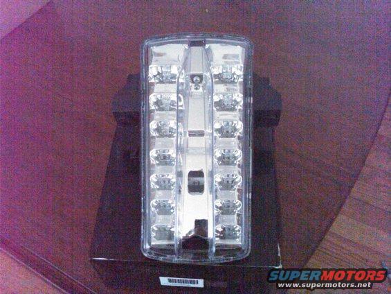 Clear lens tail light with multiple LEDs, sitting on a box